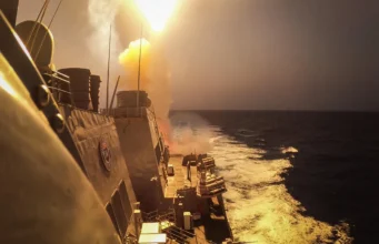 Cheap drones, scarce missiles: what it takes to keep an air defence going A missile leaves a warship's deck in a bright burst of flame and smoke, lighting up the ship's superstructure and wake at dusk